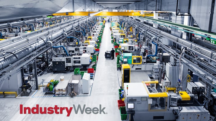 A warehouse full of machines. The text reads, "Industry Week."